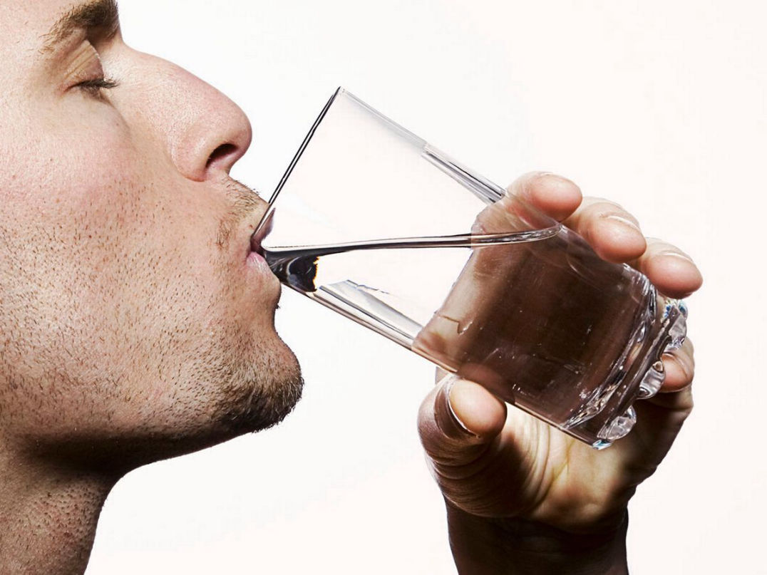 Man drinking H2 Water
